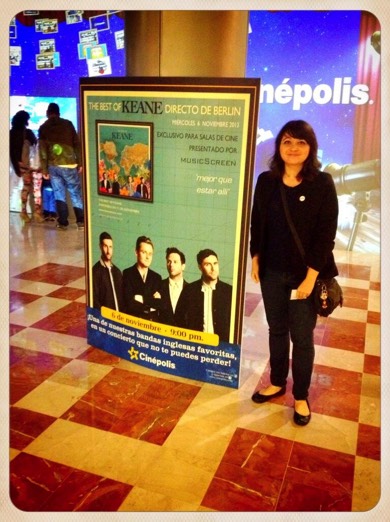 Keane fan standing in front of banner